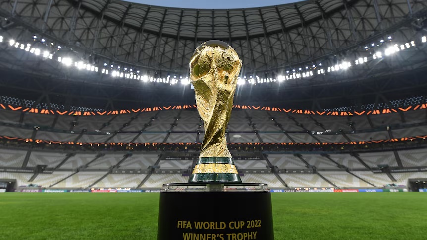 FIFA World Cup 2022 Winner’s Trophy on display at Lusail Stadium in Qatar under stadium lights
