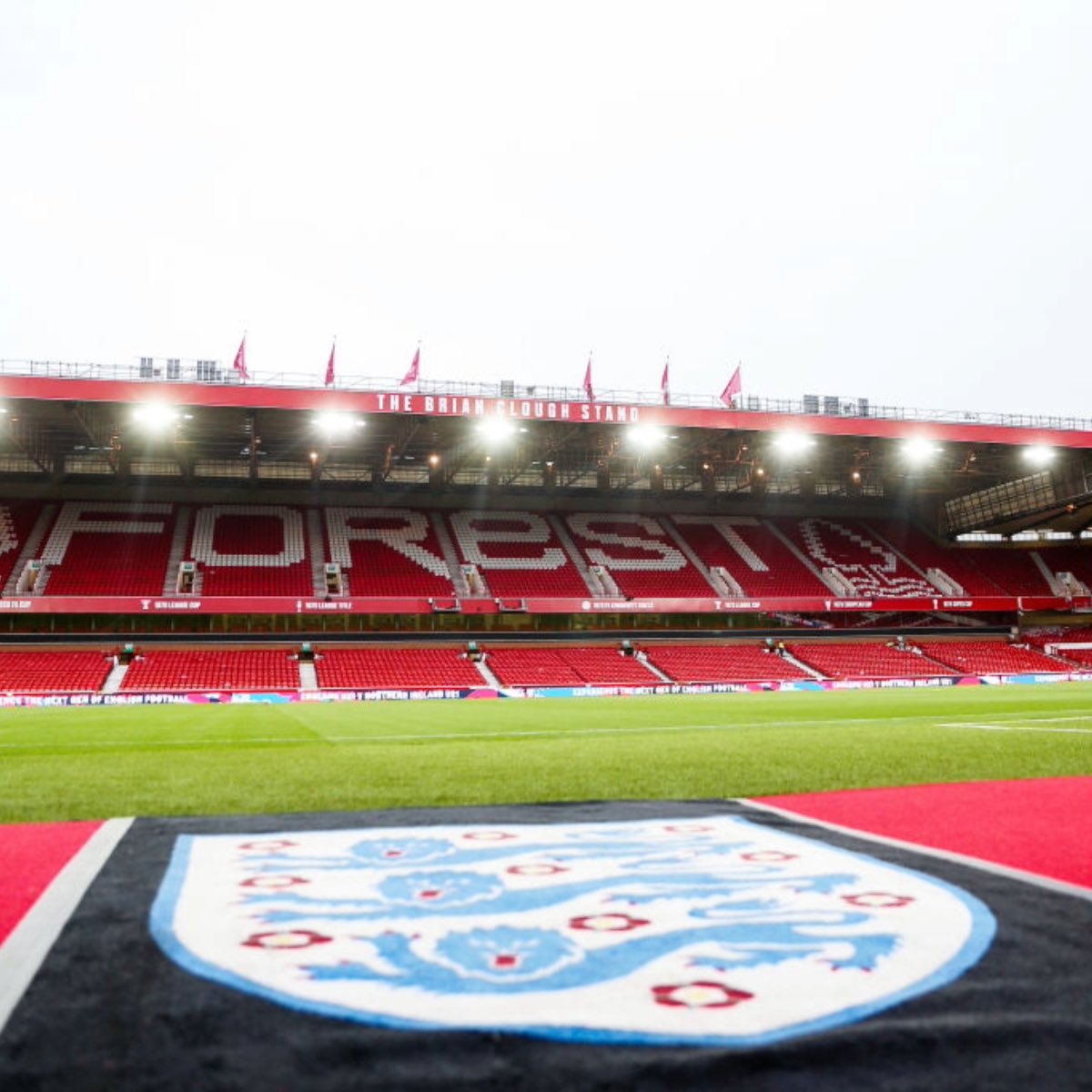England vs Senegal football match at Nottingham Forest City Ground stadium, showcasing the vibrant atmosphere and national pride