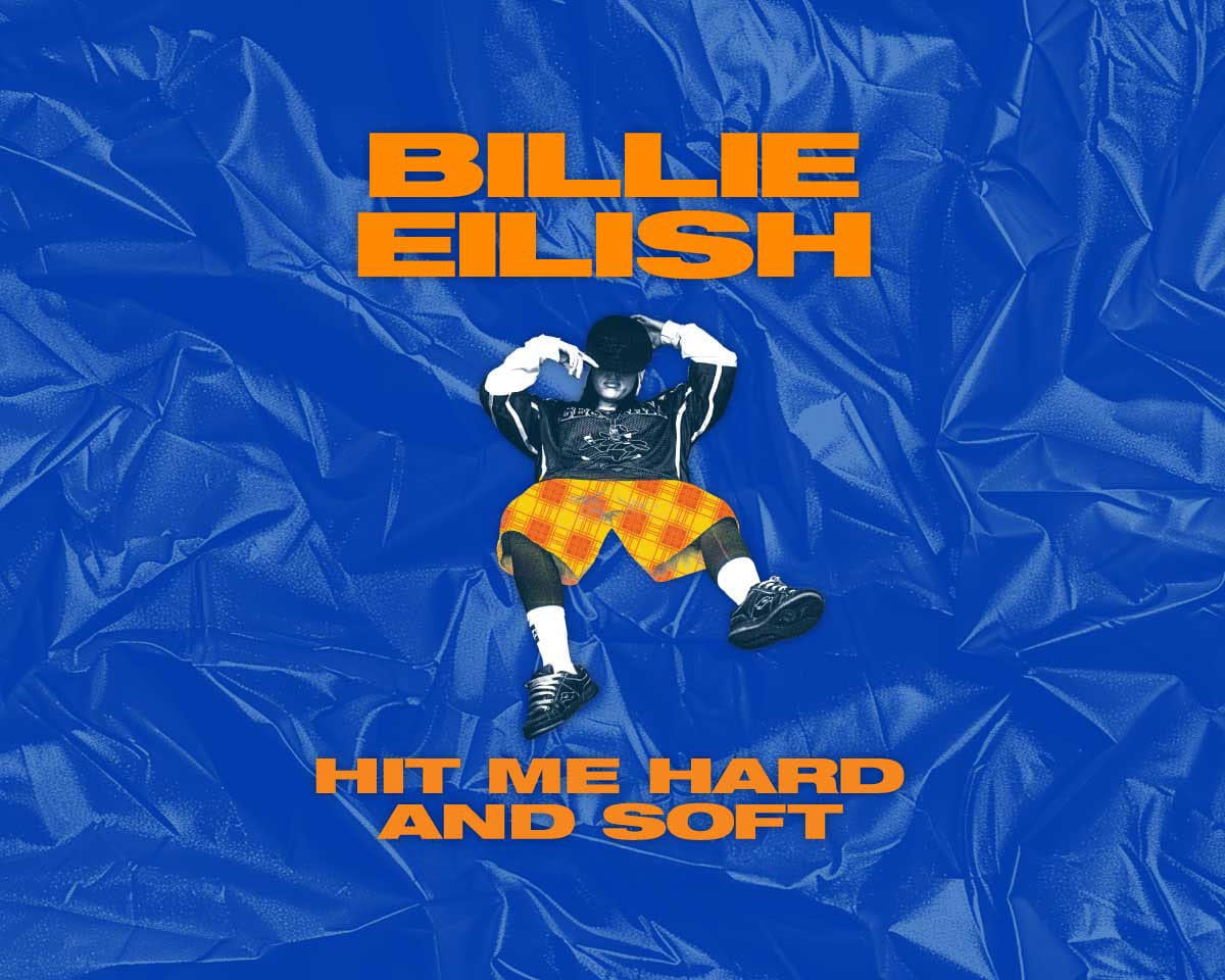 Promotional artwork for Billie Eilish’s "Hit Me Hard and Soft" tour. Billie lounges against a vivid blue, surreal backdrop, dressed in orange plaid shorts and a black outfit, while the bold title text dominates in bright orange