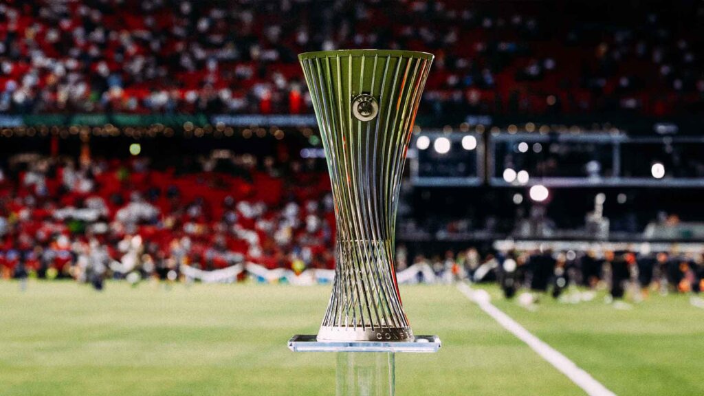 UEFA Europa Conference League trophy displayed on the pitch during a stadium event, symbolising Europe's newest club football competition.
