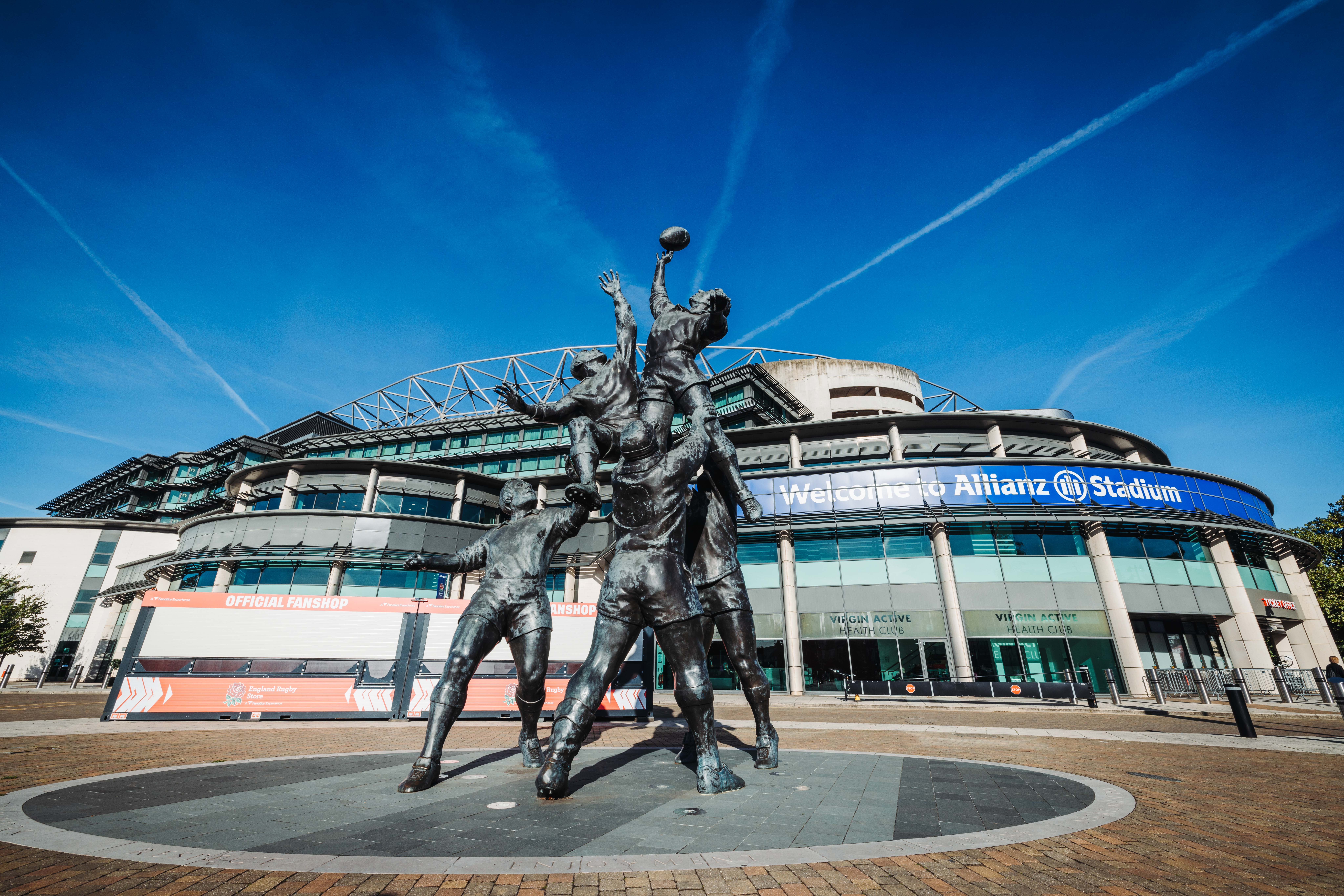 The famous 'Lineout' rugby statue in front of the main entrance to Allianz Stadium in Twickenham on a sunny day, the home of England Rugby and a premier corporate hospitality venue.