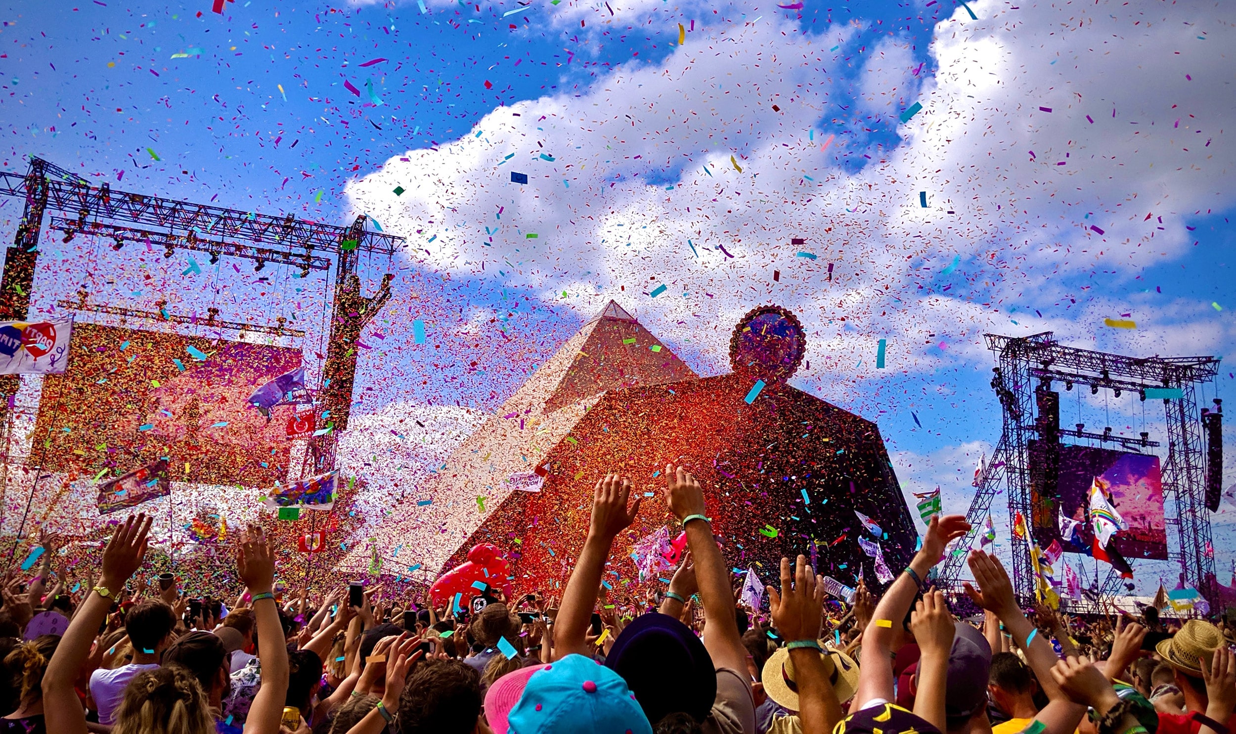 The vibrant atmosphere at Glastonbury's Pyramid Stage, representing the unforgettable festival experiences available with premium corporate hospitality packages.