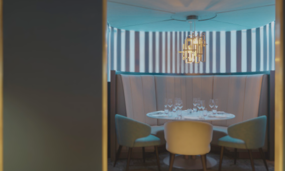 Luxury private box at Wembley Stadium twenty one package featuring elegant fine dining setup with premium seating overlooking the pitch for VIP hospitality experience
