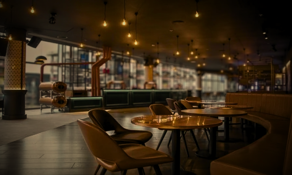 Luxury private box at Wembley Stadium twenty one package featuring elegant fine dining setup with premium seating overlooking the pitch for VIP hospitality experience